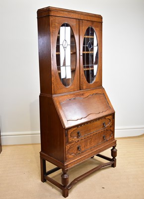 Lot 39 - An early 20th century oak bureau bookcase,...