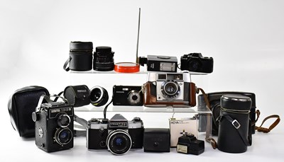 Lot 546 - Five cameras comprising a Praktica Super TL...