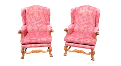 Lot 240 - A pair of reproduction upholstered wingback...