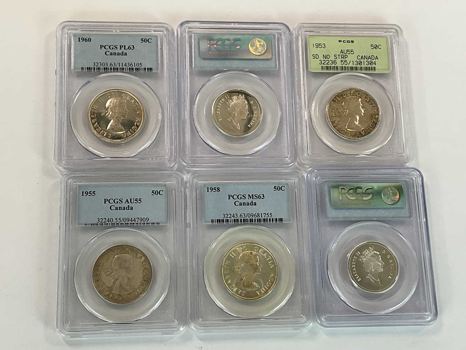 Lot 1327 - Six encapsulated coins, all with holograms and...