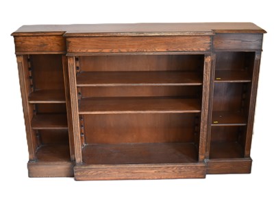 Lot 26 - A reproduction oak breakfront bookcase of...