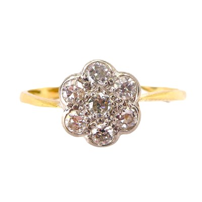 Lot 704 - An 18ct gold flower head cluster ring of small...