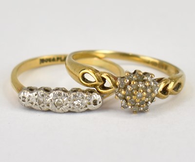 Lot 699 - An 18ct gold ring set with five tiny illusion...