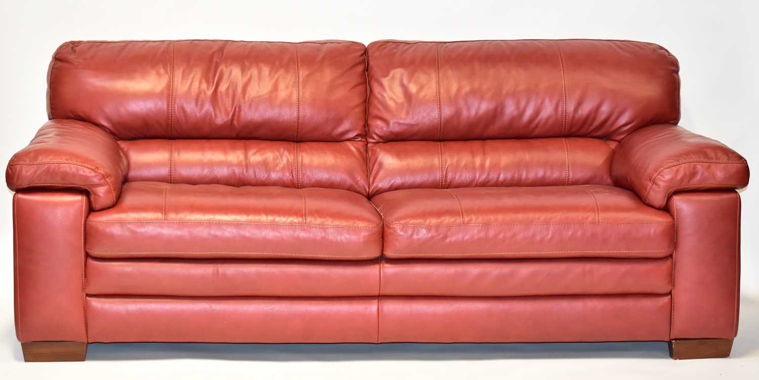 Lot 11 - A large modern red leather large sofa, 90 x...