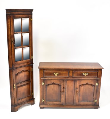 Lot 15 - A reproduction oak small sideboard with two...