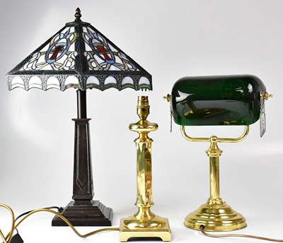 Lot 122 - A Tiffany-style table lamp with leaded glass...