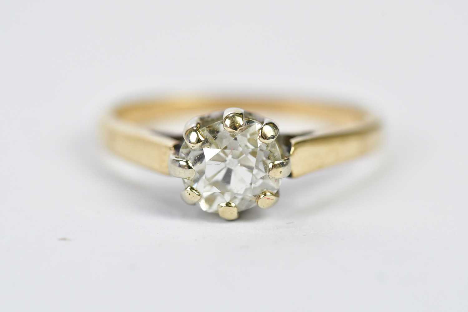 Lot 49 - A yellow metal diamond solitaire ring, the...