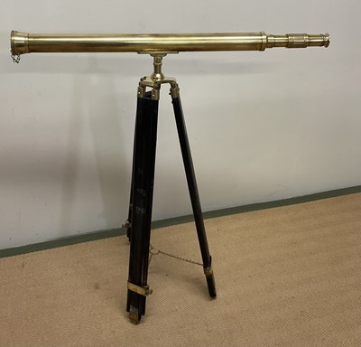 Lot 147 - A brass telescope, 98cm long, on an adjustable...