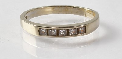 Lot 697 - An 18ct white gold ring set with five square...