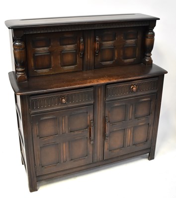 Lot 3 - ERCOL; a dark stained elm court cupboard, 127...