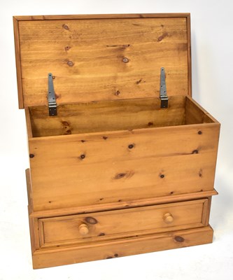 Lot 94 - A modern waxed pine blanket box with lift-up...