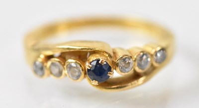 Lot 748 - A yellow metal ring set with central blue...