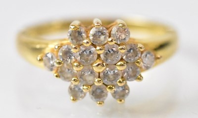 Lot 749 - A yellow metal cluster ring set with sixteen...