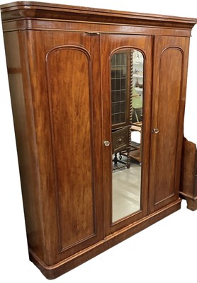 Lot 21 - A Victorian mahogany three door wardrobe with...