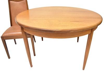 Lot 6 - G-PLAN; a circular extending dining table,...