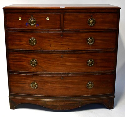 Lot 76 - A George III mahogany bow-fronted chest of two...
