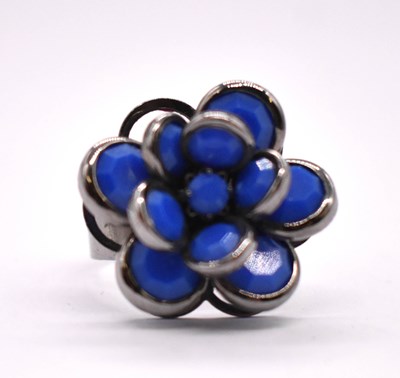 Lot 406 - An unusual white metal floral ring, the box...