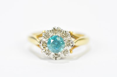 Lot 188 - An 18ct yellow gold topaz and diamond floral...