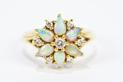 Lot 143 - An 18ct yellow gold diamond and opal floral...