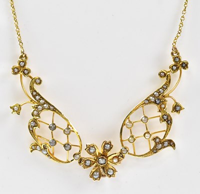 Lot 769 - An Edwardian 15ct gold necklace set with seed...