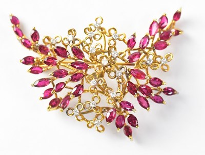 Lot 758 - A 1970s 14ct gold brooch set with rubies and...