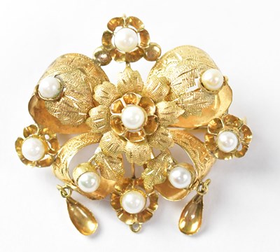 Lot 763 - A yellow metal brooch in the form of a flower...