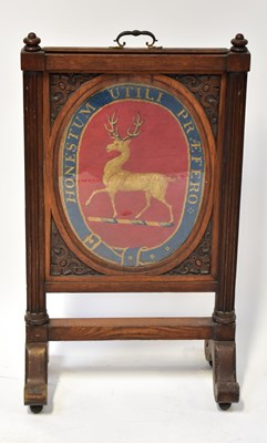 Lot 61 - A Victorian oak fire screen with tapestry...