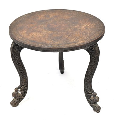 Lot 95 - An Indian carved wooden circular topped side...