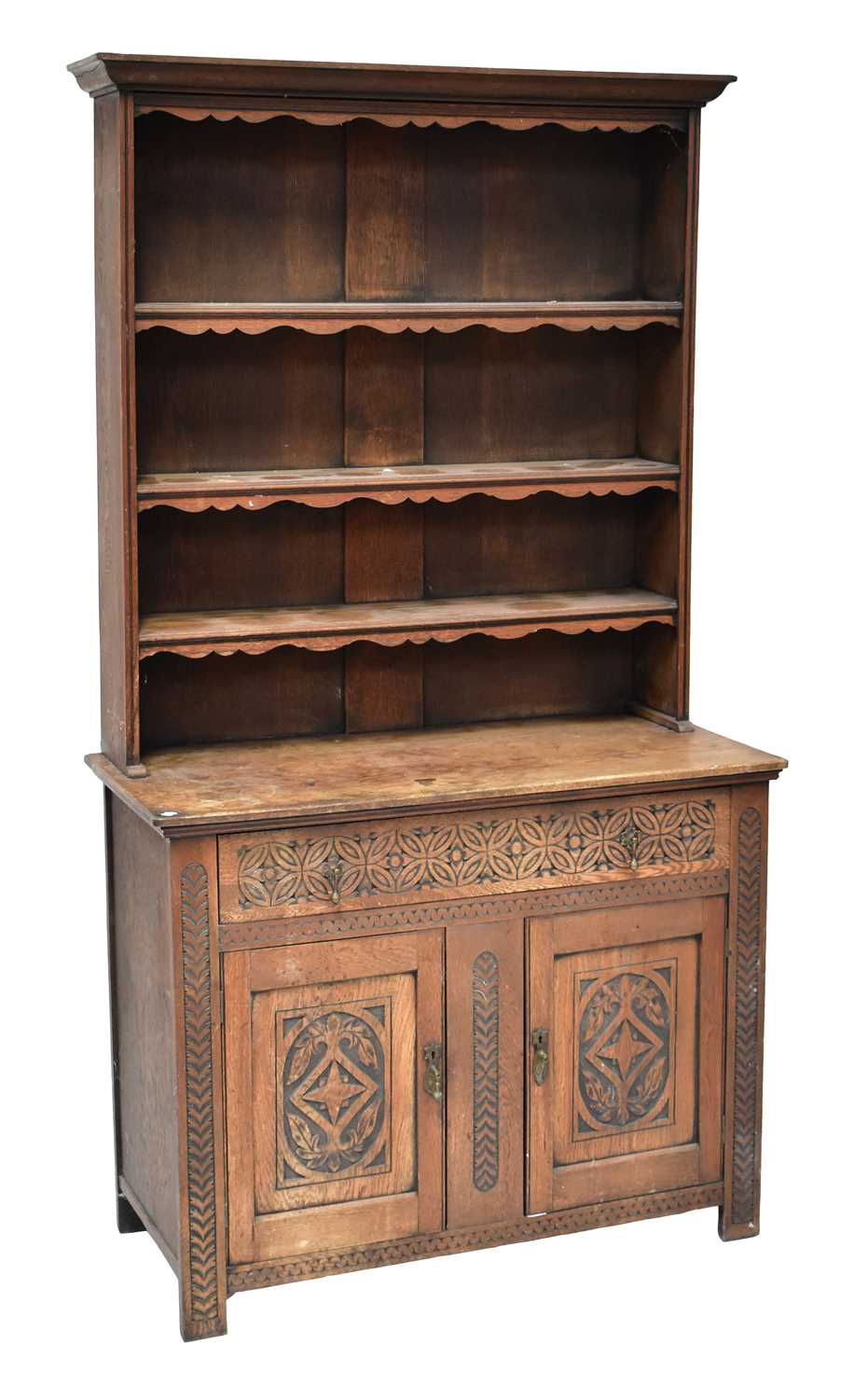 Lot 42 - An early 20th century carved oak dresser with...