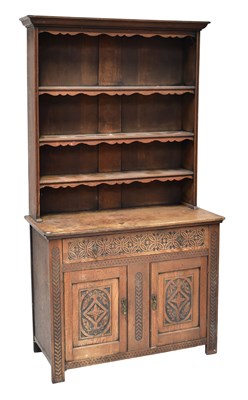 Lot 42 - An early 20th century carved oak dresser with...