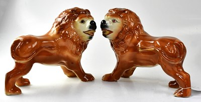 Lot 348 - STAFFORDSHIRE; a pair of lions with applied...