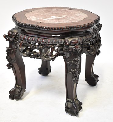 Lot 98 - A small Chinese hardwood carved plant stand...