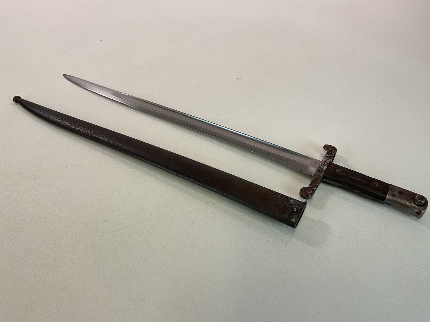 Lot 18 - A British Victorian bayonet with scabbard,...