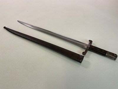 Lot 18 - A British Victorian bayonet with scabbard,...