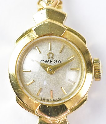 Lot 876 - OMEGA; an 18ct gold ladies' wristwatch, the...