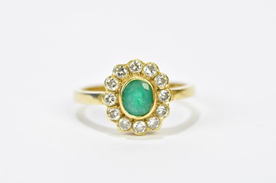 Lot 108 - An 18ct yellow gold diamond and emerald...