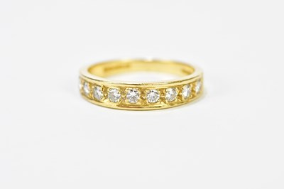 Lot 142 - An 18ct yellow gold and nine stone half...