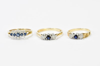 Lot 141 - Three 9ct yellow gold sapphire and diamond...