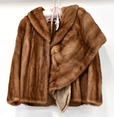 Lot 403 - A mink fur jacket with embroidered silk lining,...