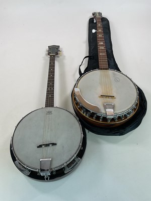 Lot 177 - An Antonia four string banjo and a German five...