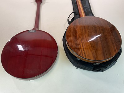 Lot 177 - An Antonia four string banjo and a German five...