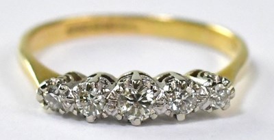 Lot 698 - An 18ct gold ring set with five white gold...