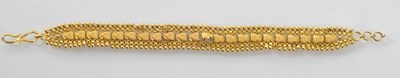 Lot 1232 - An Indian 22ct yellow gold fine link bracelet,...