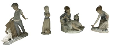 Lot 550 - LLADRÓ; two porcelain figures of young girls,...