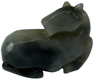 Lot 1211 - A small Chinese carved black hardstone figure...