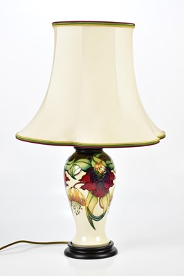 Lot 1375 - MOORCROFT; an 'Anna Lily' pattern lamp, height...