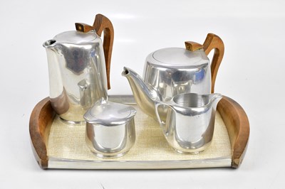 Lot 801 - PICQUOT WARE; a four piece tea set with wooden...