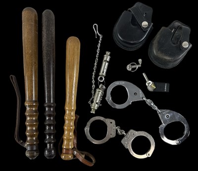 Lot 296 - A group of three police truncheons, two pairs...