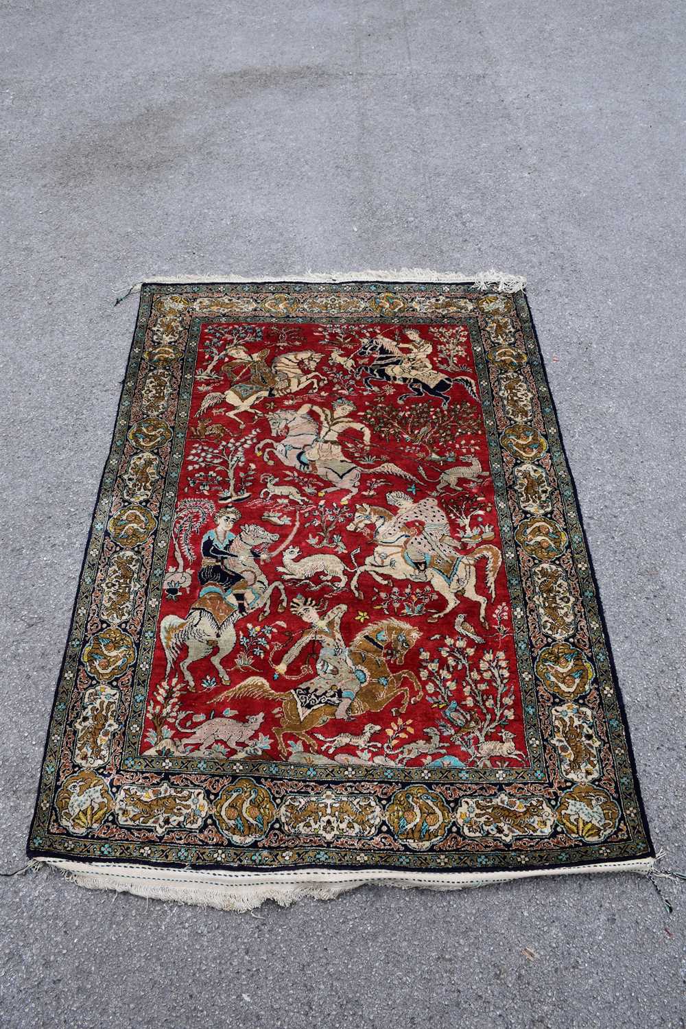 Eastern Rug Designs Lot 444 - An Eastern style part silk rug, decorated