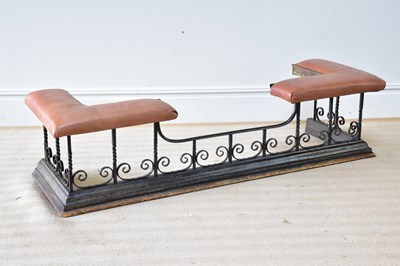 Lot 775 - A wrought iron club fender with scrolling...